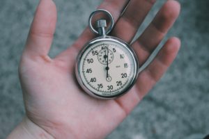 Hand holding stopwatch