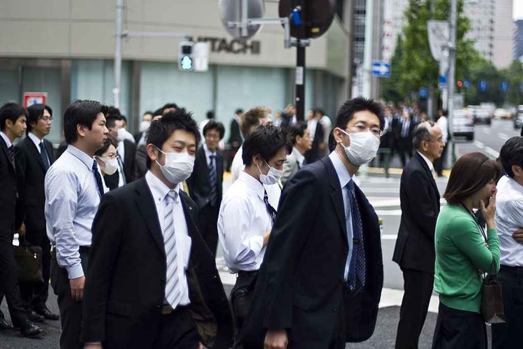 Business men wearing flu masks